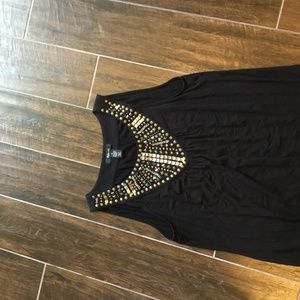 Black shirt with metal detail.